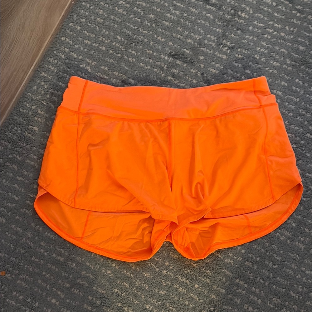 LULULEMON neon orange speed up 10